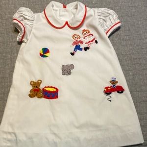 Woman’s Exchange Raggedy Ann and Raggedy Andy hand embroidered dress.
